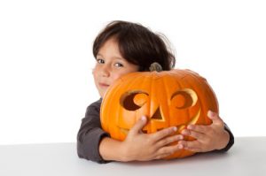 Halloween pumpkin and child