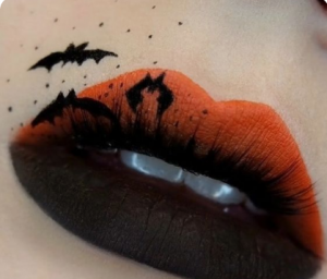 black and red halloween lip makeup with bats