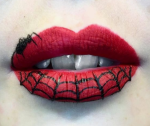 spiderman Halloween face makeup with tiny spider and web