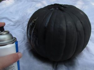 spraying pumpkin