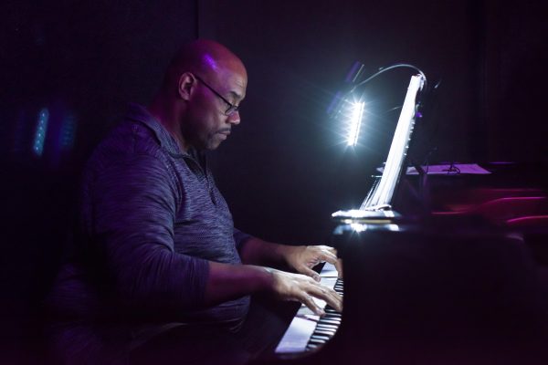 Song composer and lyricist Julius Juice Davis composes a tune at his keyboards