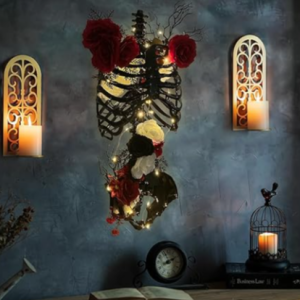 a Halloween skeleton torso sits on a wall