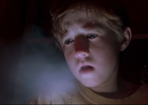 Cole from the movie The Sixth Sense blows cold air under his bedroom tent